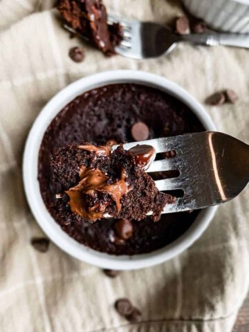 down view of mug brownie with a small scoop on a fork