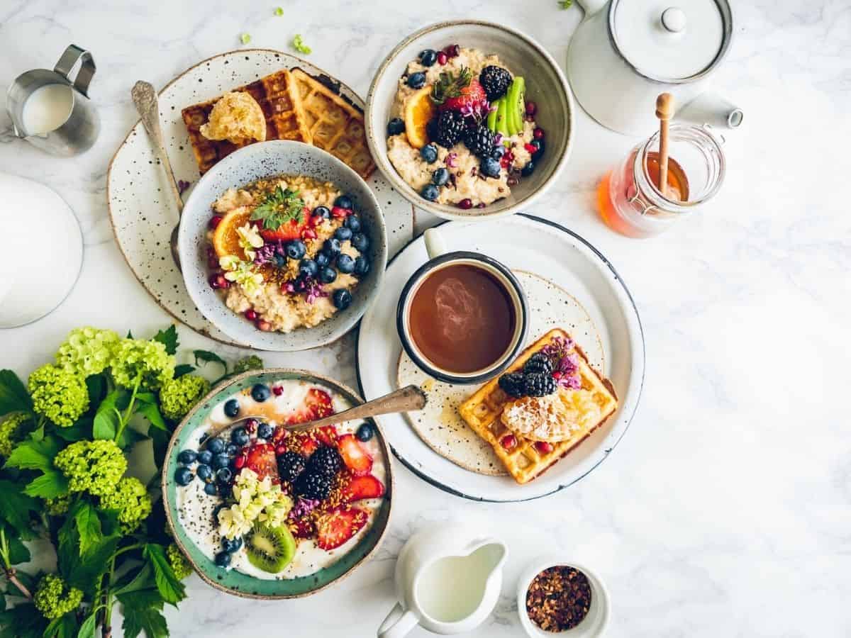 Breakfast spread out on a white table. 