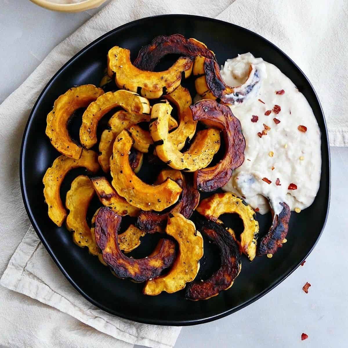 Delicate squash fries with spicy white bean dip for a savory plant based snack