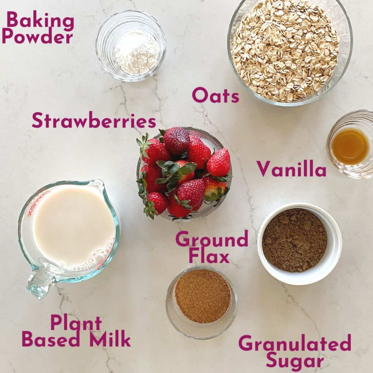 Ingredients for strawberry baked oatmeal- strawberries, oats, milk, ground flax, baking powder, sugar, vanilla 