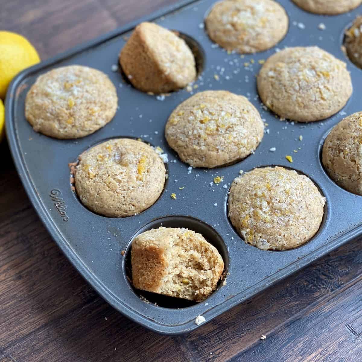 vegan lemon poppyseed muffins in the muffin pan, baked.