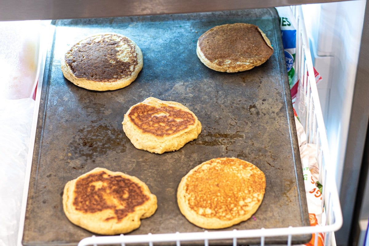 five Pancakes on a sheet pan in the freezer. 
