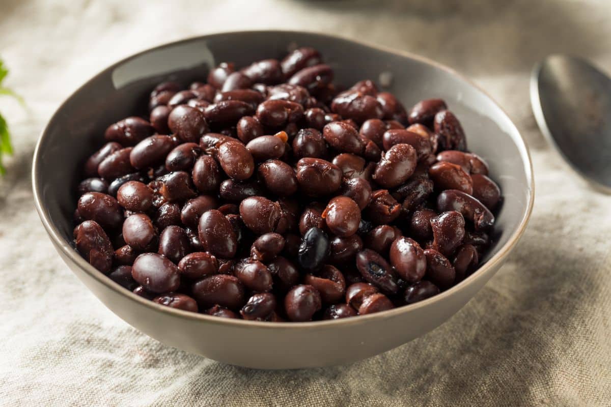 A bowl of cooked black beans.