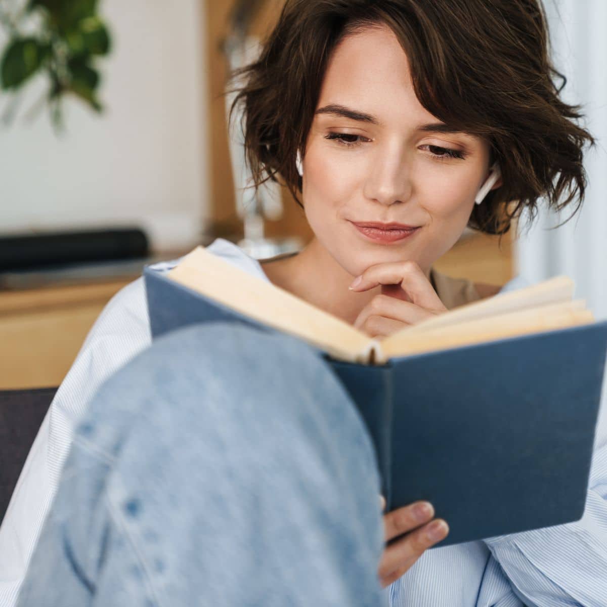 woman reading a book about mindful eating 