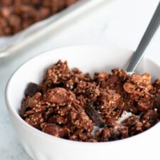 bowl of dark chocolate granola with oats and chocolate chunks, nutritious breakfast or snack