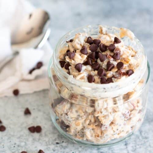 Cookie dough overnight oats in a jar, thick, doughy, and topped with chocolate chips for a high-fiber, high-protein breakfast.